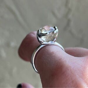 🔴Sale item . Crystal ring size 7 . Two persons holding earth